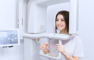 The girl having Cone Beam Computed Tomography (CBCT) test in Villanova dental center at Stittsville, ON