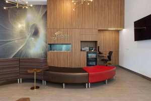 Dental clinic lobby featuring modern decor, seating, and a reception counter in the Main Street Office