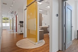 A Hallway Featuring a Bathroom and Kitchen Area Within the Dental Studio in Stittsville, ON