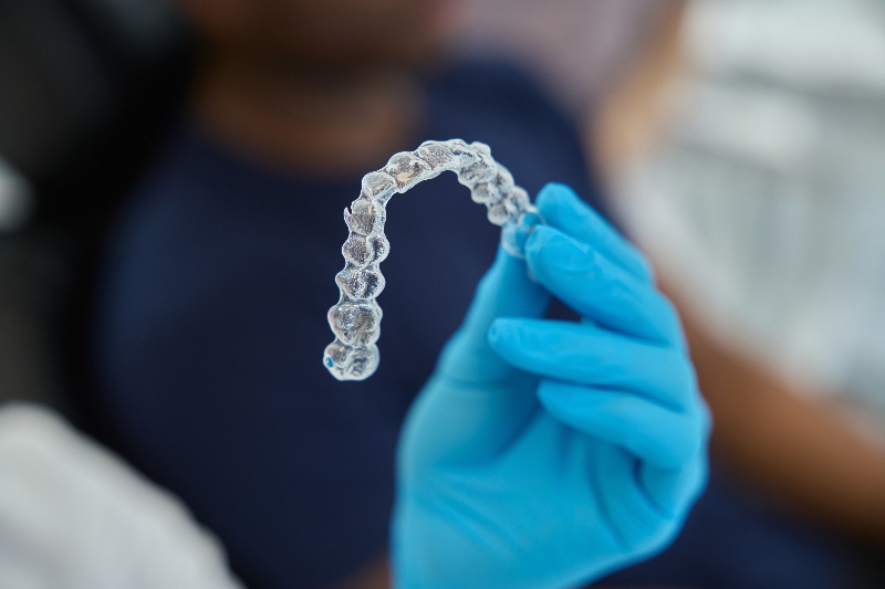 Clear aligners held by dental clinic staff in Stittsville and Kanata, ON