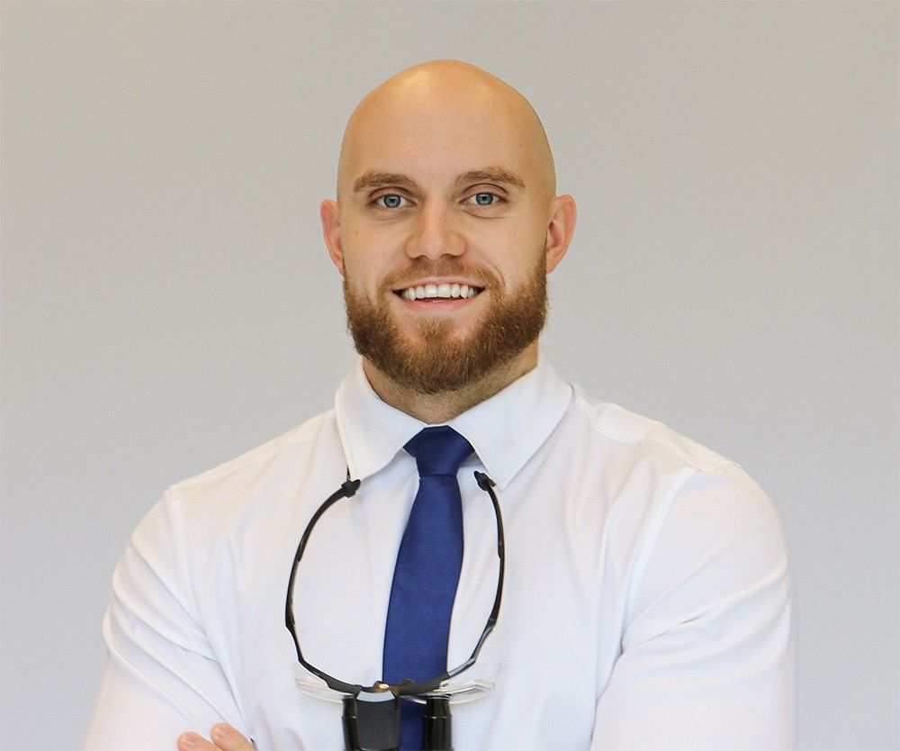 Dr. Tudor Mititelu at Villanova Dental Studio smiling in professional dental portrait